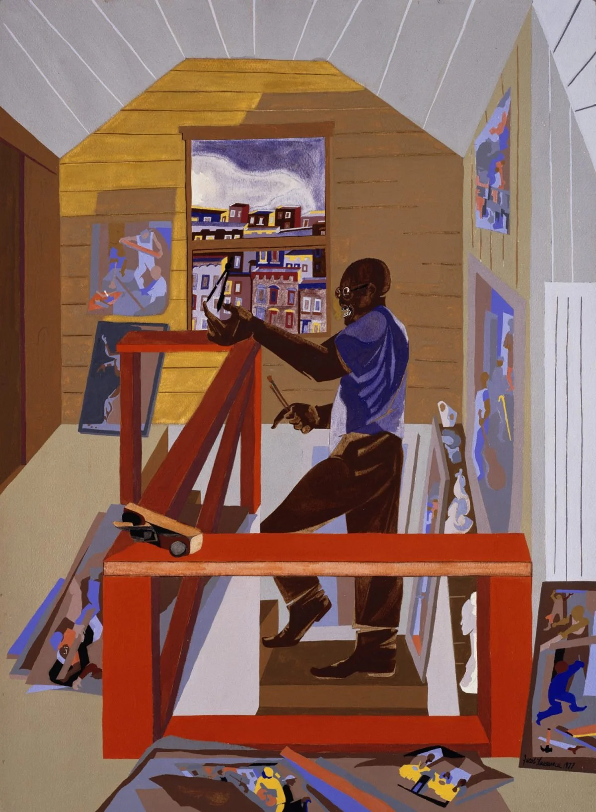 Artist working in studio with paintings and architectural drawings displayed