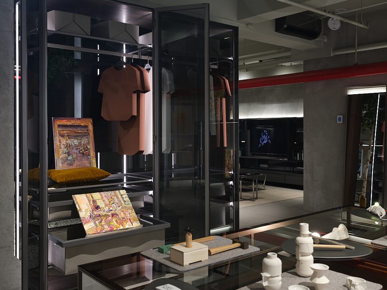 Image of dark room with artwork featured throughout the room