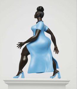 Large sculpture of a Black woman, mid-stride, wearing a blue dress